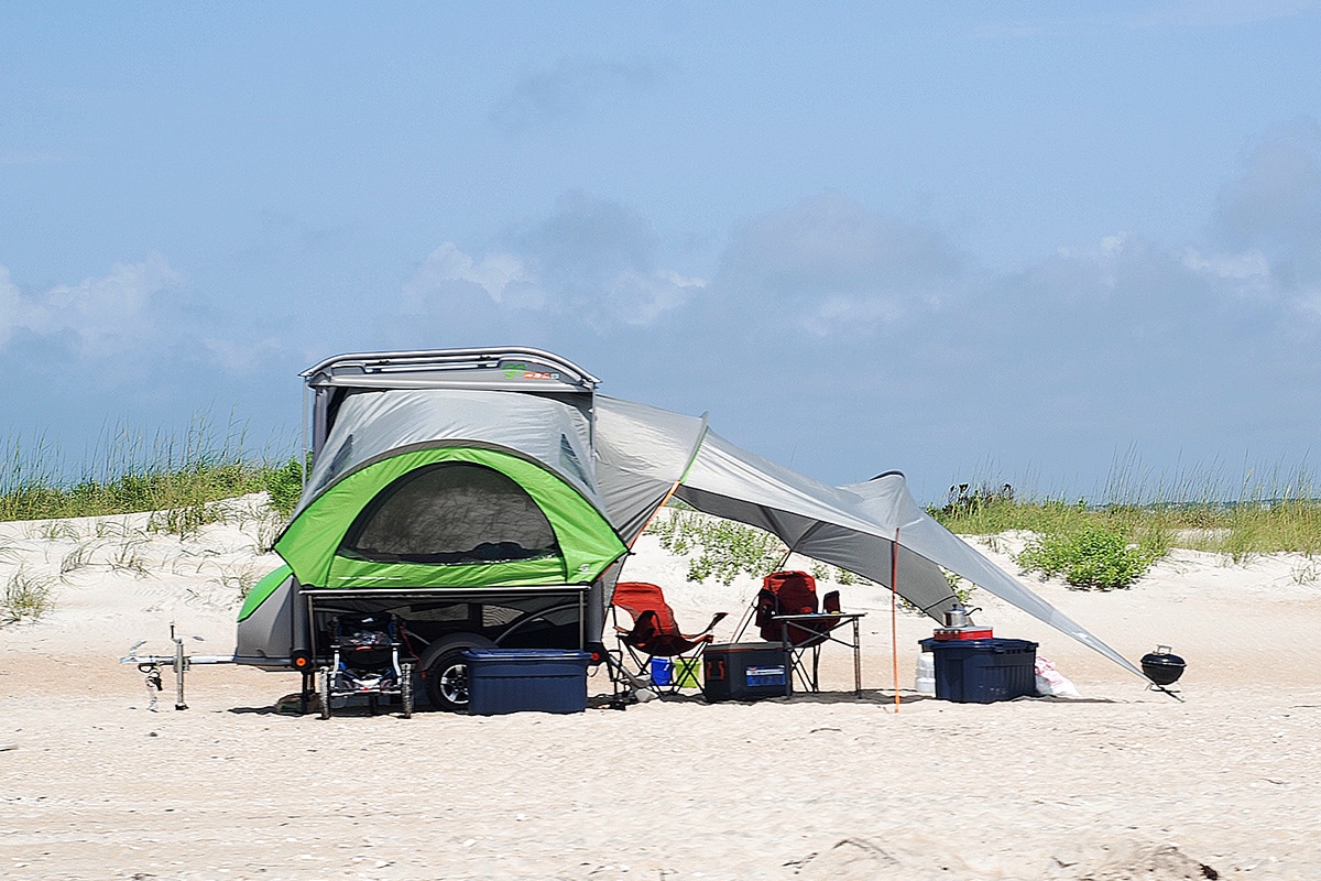 Camping on the beach with trailer tent