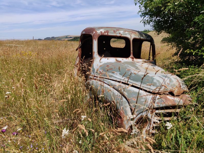 Out of the blue, we saw an old Citroën rusting away in a field.