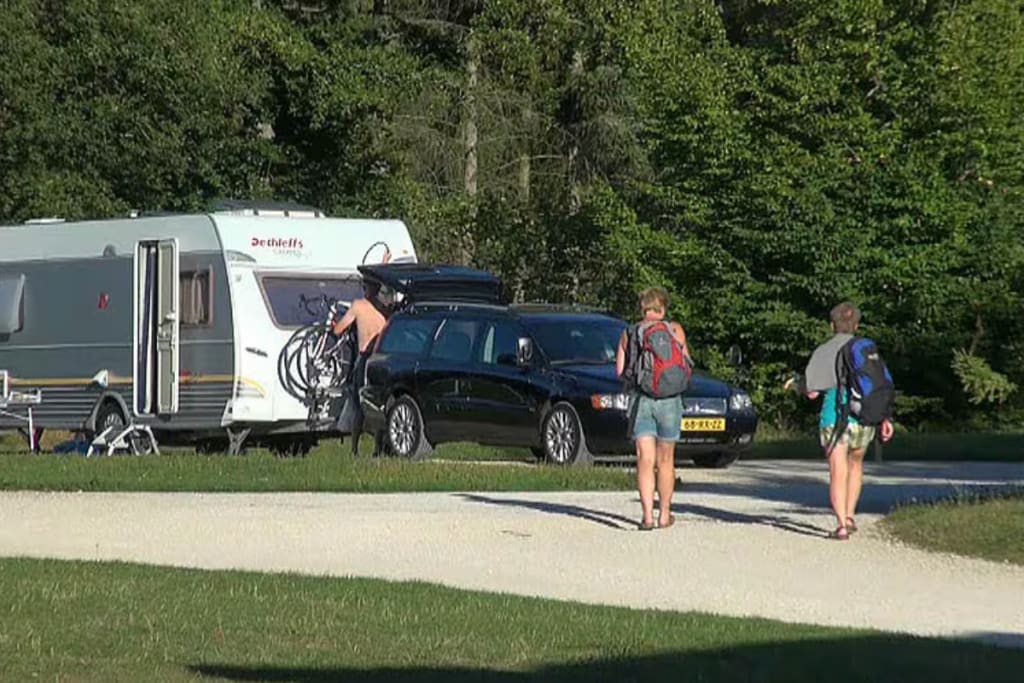 man and woman walking best hiking campsite Camping Porte des Vosges
