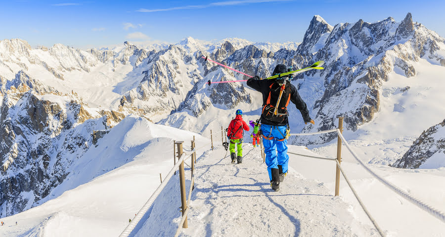 skiers hiking through the mountains of Chamonix with gear